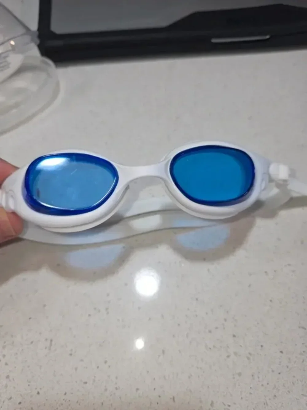Silicone swim goggles with blue mirrored lenses, white frame, unisex racing styl